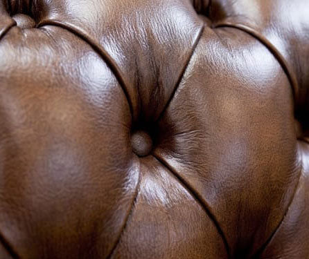 Cambridge Chesterfield deep buttoning detail showing pleated antique leather