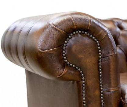 Close up of Cambridge Chesterfield scroll arm and brass nailhead trim