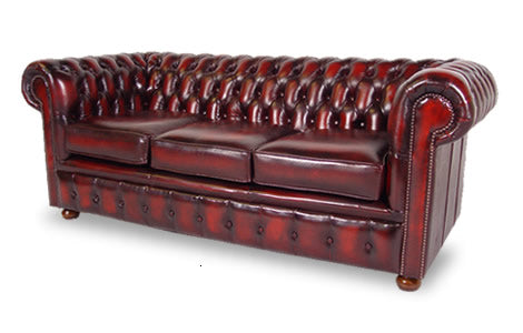 Cambridge Chesterfield in antique oxblood leather with deep buttoned back and rolled arms