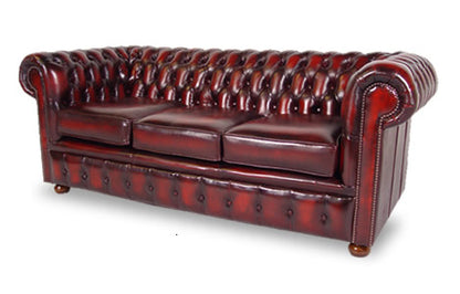 Cambridge Chesterfield in antique oxblood leather with deep buttoned back and rolled arms